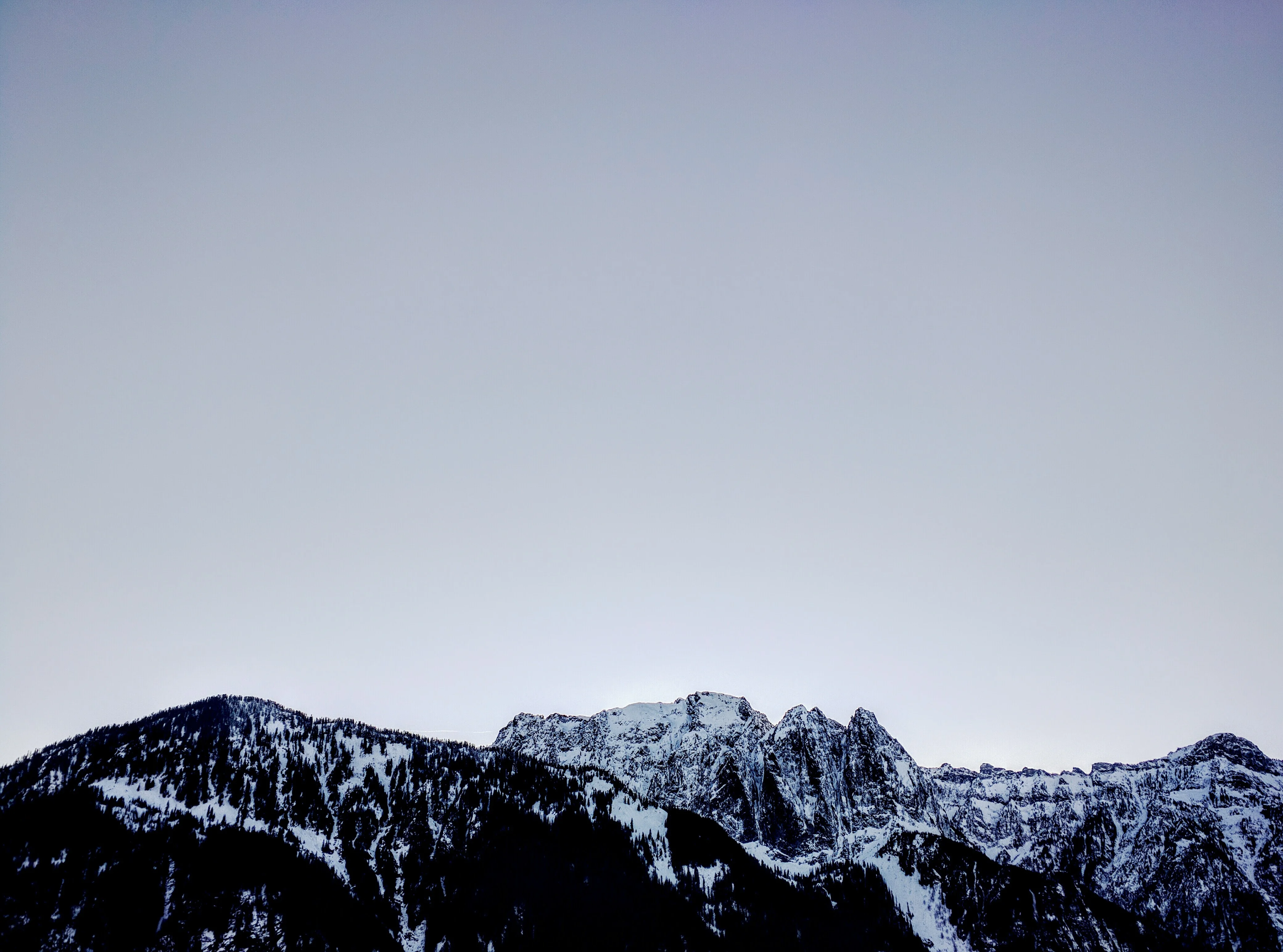 Mount Index rises across a forested valley as seen from Heybrook Lookout.