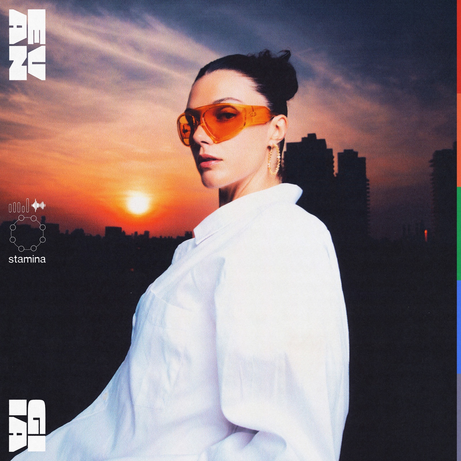 EVAN GIIA wearing orange sunglasses against a sunset skyline on the cover of STAMINA